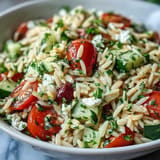 Vibrant Summer Orzo Salad featuring creamy feta, bright lemon dressing.