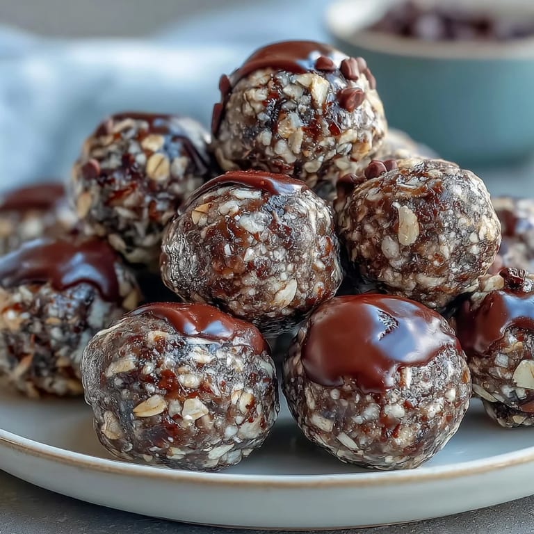 Easy no-bake energy balls packed with wholesome oats, creamy peanut butter, and mini chocolate chips, ideal for soccer game snacks.