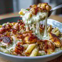 A bubbling one-pot French onion chicken pasta with melted Gruyère and caramelized onions.