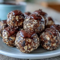 Wholesome soccer game snacks featuring energy balls made with oats, peanut butter, and chocolate chips, perfect for game day fueling.